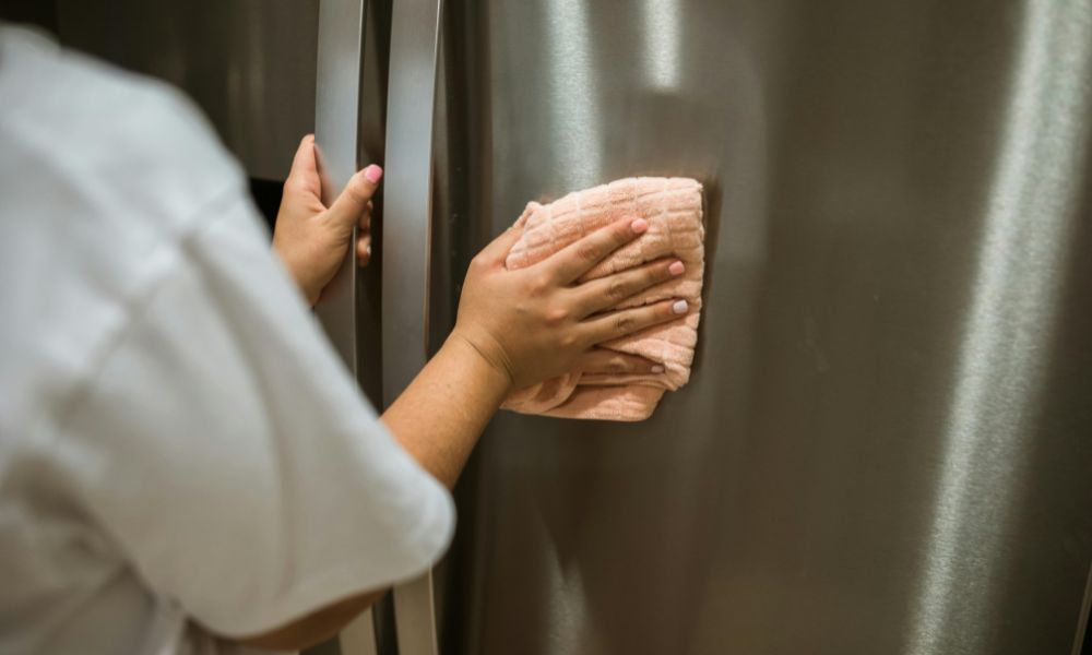 wiping the external doors of the fridge