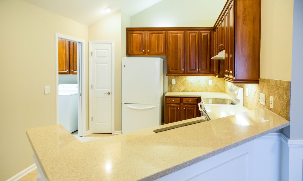 high grade polished quartz countertop with wooden cabinets