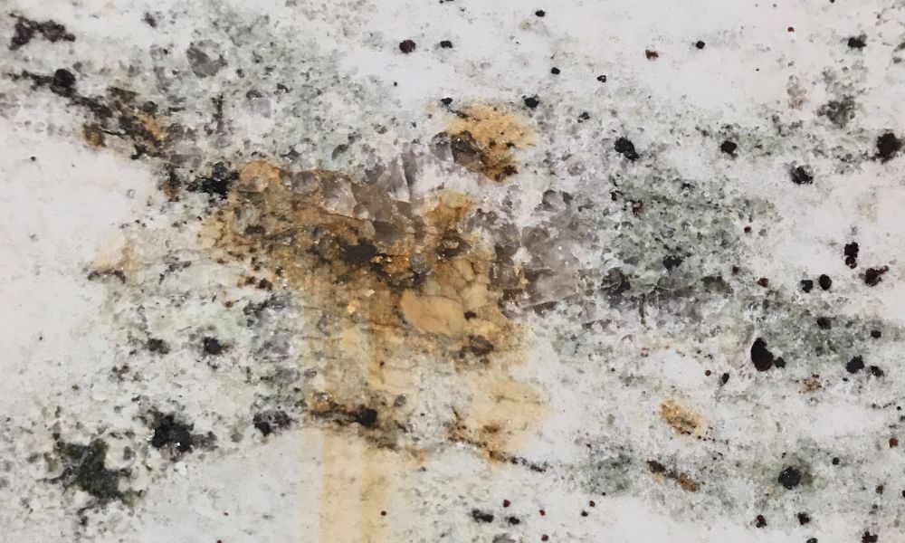 chemical burns on cheap low-grade quartz countertop surface