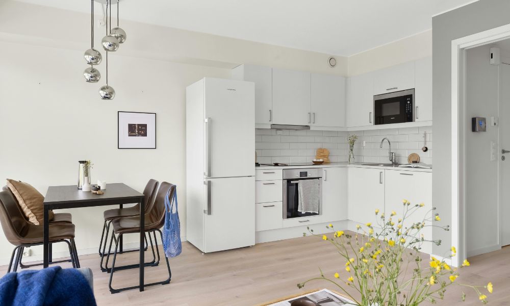 small condo design integrating kitchen, dining room and living room